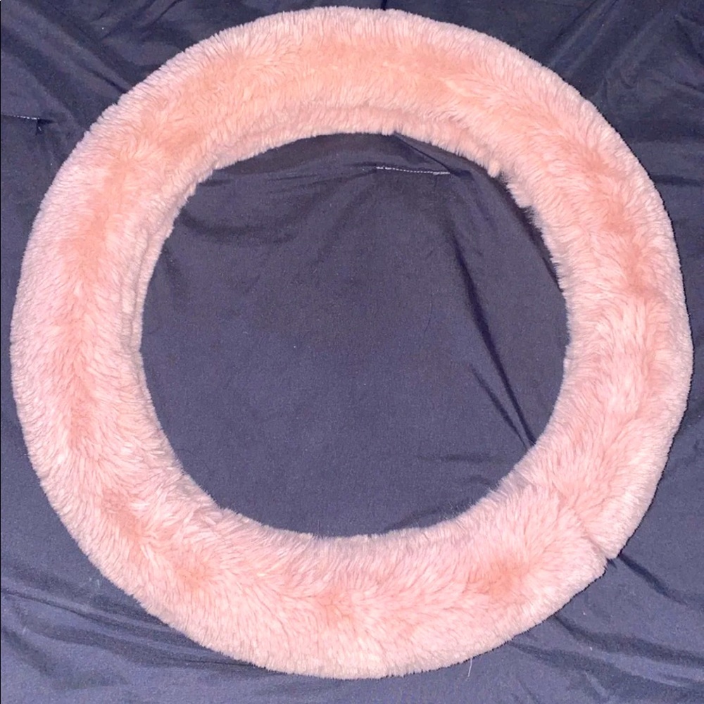 Pink fuzzy steering wheel cover